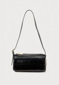 Black patent leather handbag with a cylindrical shape, single shoulder strap, and a gold zip closure. Smooth texture with subtle sheen.