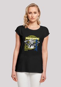 Schwarzes T-Shirt mit kurzen Ärmeln, das ein Grafik eines Sängers zeigt, mit dem Text "David Bowie Live in Concert 1973" und gelben sowie blauen Akzenten.