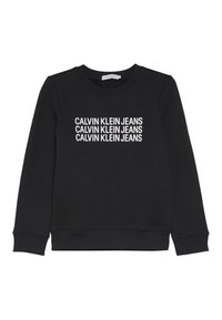 Černá mikina vyrobená z měkké látky, která má na přední straně více řad bílého textu "CALVIN KLEIN JEANS", kulatý výstřih a dlouhé rukávy.