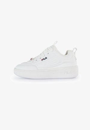 White FILA sneakers with a smooth synthetic upper, rounded toe, thick sole, and lace-up design. Features a logo on the side and back.