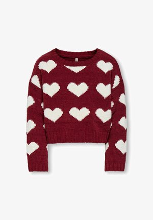 Rdeča pletena kratka jakna z velikimi belimi srčnimi vzorci, rebrastim robom in dolgimi rokavi z tako teksturirano tkanino.