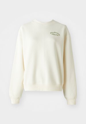 Sweatshirt crème avec col rond, manches longues, bords côtes aux poignets et "New Balance Athletics" brodé sur la poitrine gauche.