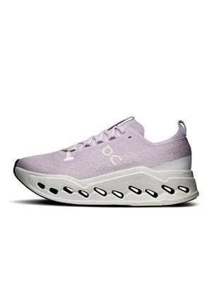 Light purple athletic shoe with white sole featuring black oval cutouts and a pull tab on the heel, side logo visible on knit upper.
