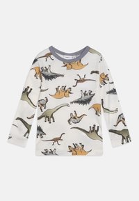 Majica dugih rukava od mekog, bijelog materijala s raznim uzorcima dinozaura u više boja. Sivi rub na ovratniku, ležeran kroj.