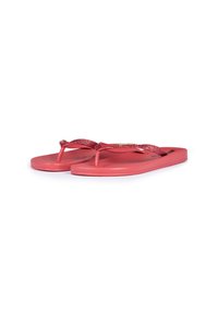 Coral flip-flops with a textured sole, featuring shimmering pink straps and a textured footbed for added grip and comfort.