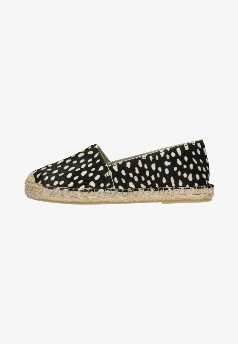 Espadrille slip-on à pois noirs et blancs avec semelle tissée en jute et bout arrondi.