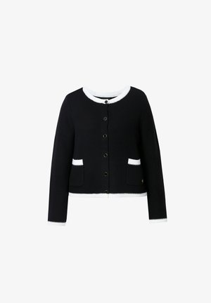 Gilet en tricot noir avec des bords blancs, doté de manches longues, d'un col rond, d'une fermeture à boutons à l'avant et de deux poches avant.