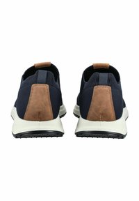 Navy knit sneakers with brown suede accents, pull tabs, and white midsole. Features a textured design and contrast heel detail.