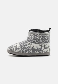 Gray and white patterned knitted slipper with a soft fabric upper, low ankle height, and black accent around the opening. Flat rubber sole.
