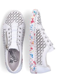 White sneakers with perforated upper, lace and zip closure, and colorful patterned sole. Features a round toe and textured detailing.