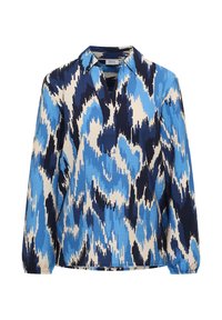 Blouse à manches longues avec col, encolure en V, et poignets élastiques, présentant un motif abstrait en zigzag bleu, marine et crème.