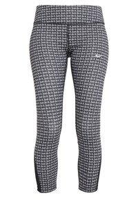 Legginsy z powtarzającym się czarno-białym wzorem tekstu "Po prostu to zrób", o dopasowanym kroju i elastycznym materiale.