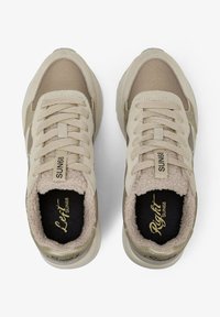 Pair of beige lace-up sneakers with soft fleece lining, labeled "Left" and "Right" inside, and "SUN68" on tongue tags.