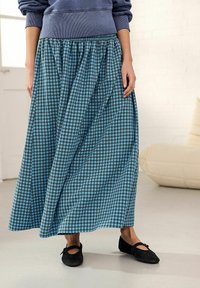 Gonna maxi a quadri blu e neri con vita elastica, caratterizzata da un design fluido e realizzata in tessuto morbido.