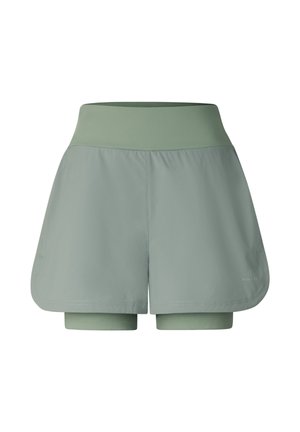 High-waist green athletic shorts with built-in compression layer shown on white background.