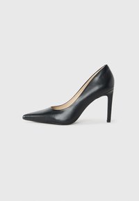 Black leather pointed-toe high heel shoe with a slim stiletto heel on a white background.