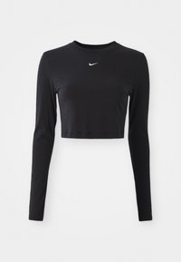 Svart langermet cropped topp laget av glatt stoff, med rund hals og en hvit Nike-logo på brystet.