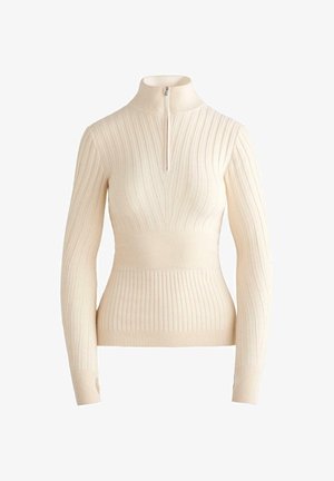 Pull en maille côtelée couleur crème avec une fermeture éclair mi-longue, design ajusté, manches longues et motifs de côtes contrastés, étroits et larges.