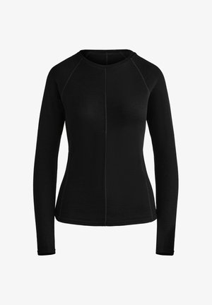 Haut noir à manches longues avec un col rond. Dispose de manches raglan et de coutures plates pour le confort. Fabriqué en tissu texturé.