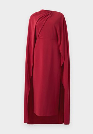 Red knee-length dress with draped fabric detail and matching long cape flowing from one shoulder, displayed against white background.