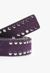 Purple suede belt featuring silver studs along the edge, with a smooth texture and a rectangular buckle end.