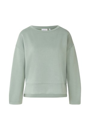 Jasnozielona bluza z długim rękawem, okrągłym dekoltem i luźnym krojem, z subtelnym przeszyciem w pobliżu dołu.