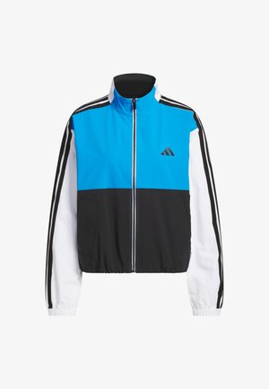 Modrá, čierna a biela bunda so zipsom a elastickými manžetami. Na rukávoch sú tri pruhy a na hrudi logo. Vyrobená z ľahkého materiálu.
