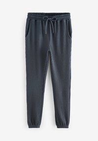 Mörkgrå ribbade joggers med elastisk midja, justerbar dragsko och sidofickor, med ett texturerat tyg.