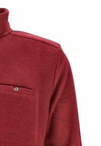 Burgunderfarbene, strukturierte Jacke mit hohem Kragen und einer kleinen Klappentasche mit einem Knopf auf der Brust.