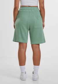 PROHIBITED Tracksuit bottoms - basilgreen