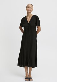 Vestido negro de botones con mangas cortas abullonadas, escote en V profundo y longitud midi, confeccionado en una tela suave para un ajuste relajado.