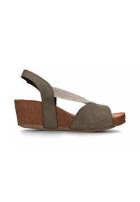 Sandalo wedge in suede verde con punta aperta, cinturino elastico e base in sughero. Presenta una finitura liscia e una silhouette sagomata.