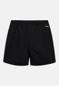 Costume da bagno neri realizzati in materiale leggero con vita elastica. Presenta un piccolo logo verde sul retro. Senza tasche.