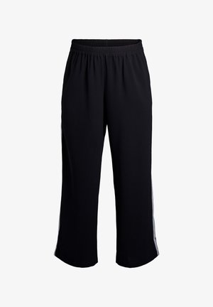 Czarne spodnie dresowe z elastycznym pasem, luźnymi nogawkami i białymi paskami po bokach na białym tle.