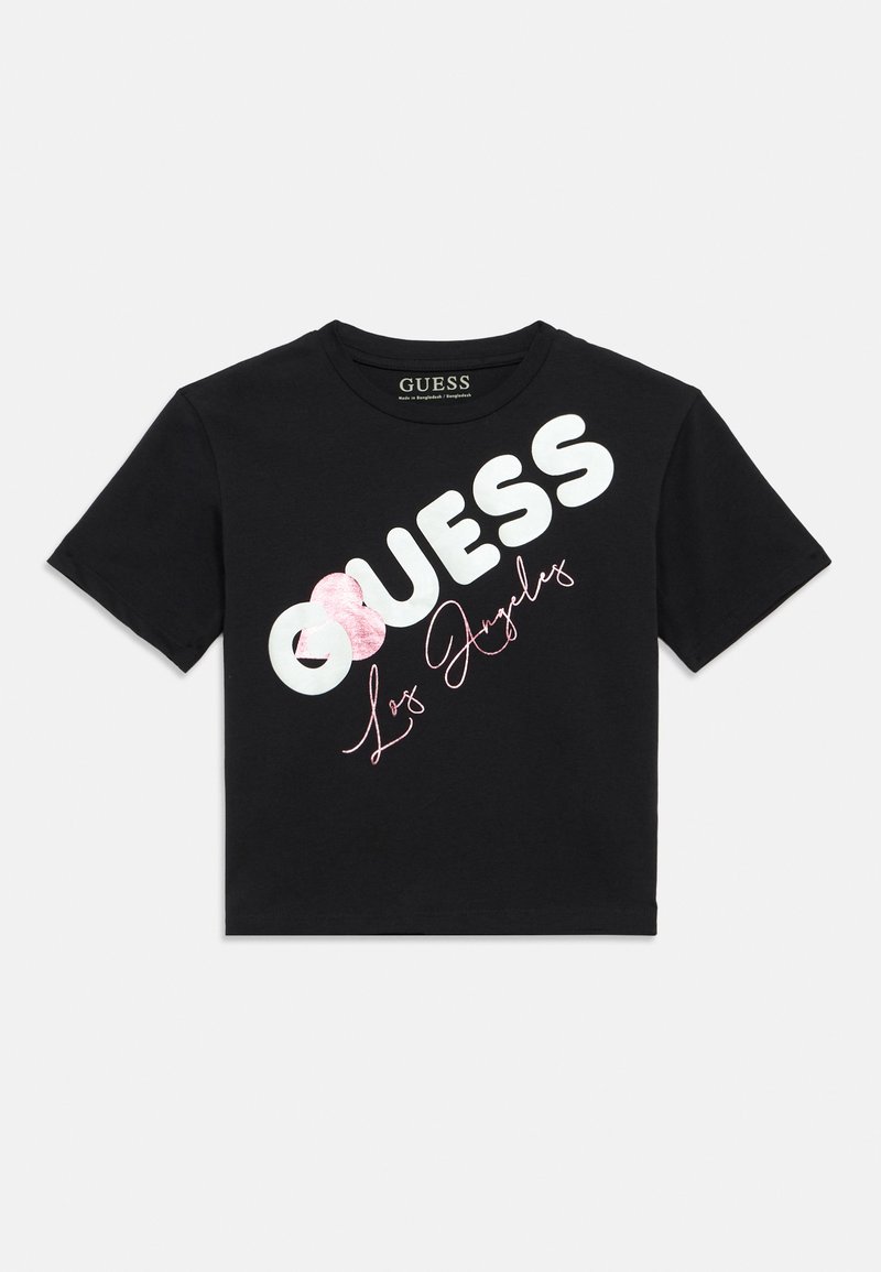 Μαύρο cropped t-shirt με έντονα λευκά γράμματα "GUESS" και ροζ γραφικό κείμενο "Los Angeles" με λεπτομέρεια ροζ καρδιάς. Κατασκευασμένο από βαμβάκι.