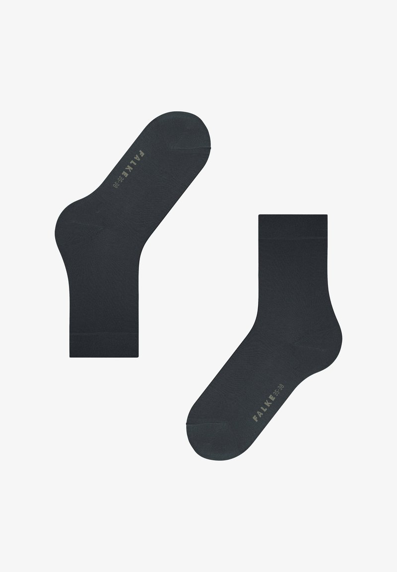 Calcetines de algodón negros con una textura suave y puntera reforzada. Cada calcetín presenta un nombre de marca en relieve en el lateral.