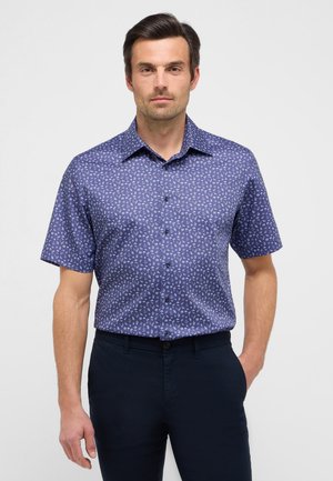 Short-sleeve, button-up shirt in dark blue with a small white floral pattern. Made of lightweight fabric with a smooth texture.