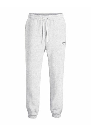 Pantalons de survêtement gris clair en tissu mélangé de coton. Dotés d'une taille élastique avec cordon de serrage et de poignets côtelés. Petit logo sur le côté gauche.