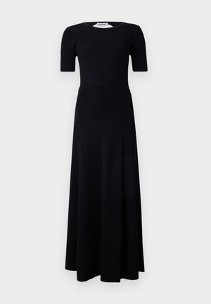 Sort maxi kjole med ribbet overdel, korte ærmer og en flydende nederdel. Lavet af glat stof i en ensartet farve.