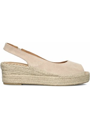 Sandale espadrille compensée en cuir suédé beige avec bout ouvert, semelle plateforme en jute tressée et bride arrière.