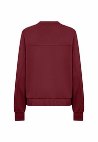 Mörkröd långärmad sweatshirt med resårkantade ärmar och nederkant, visad bakifrån mot en vit bakgrund.