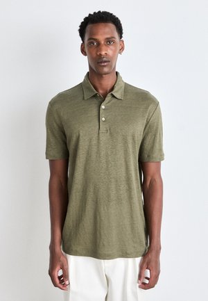 Olivgrünes Polo-Shirt aus strukturiertem Stoff mit einer Knopfleiste mit drei Knöpfen, kurzen Ärmeln und lockerer Passform. Mit geradem Saum.
