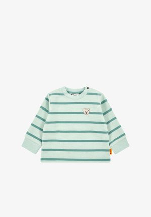 Haut à manches longues vert menthe clair avec des rayures horizontales vert foncé et une appliquée d'ours sur la poitrine. Présente un col rond et une fermeture à pression.