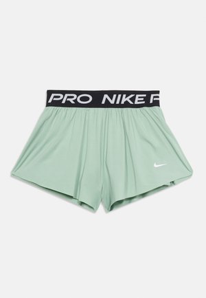 Light green Nike Pro shorts with black elastic waistband featuring "NIKE PRO" text and white Nike swoosh logo on the left leg.