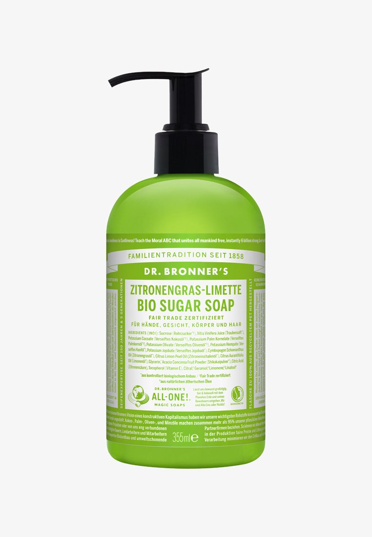 Groene plastic pompflacon van Dr. Bronner's biologische suzeep, met een zwarte pompdeksel, gelabeld in het Duits met details over ingrediënten en gebruik.