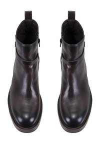 Braune Leder-Stiefeletten mit glatter Textur, runder Zehenpartie, dekorativem Riemen und seitlichem Reißverschluss. Flache, langlebige Sohle.