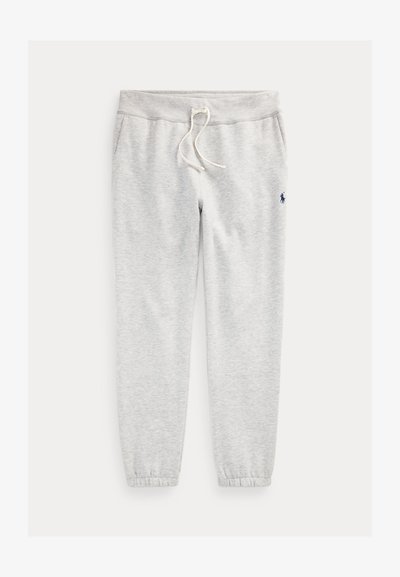 Pelēki sporta bikses, kas izgatavotas no mīksta, teksturēta materiāla, ar elastīgu jostasvietu ar auklu un pieguļošiem aprocēm. Sānos ir logotipa elements.