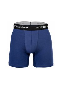 Marineblaue Boxershorts aus weichem Stoff, mit einem schwarzen Bund, der das Logo "SCOTCH & SODA" trägt, und genähten Details an den Beinen.