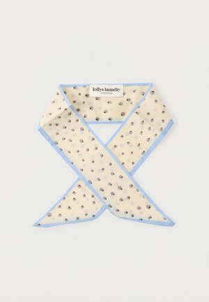 Écharpe beige clair à pois noirs avec des bords bleu clair, pliée avec une étiquette de marque visible "lollys laundry Copenhagen".