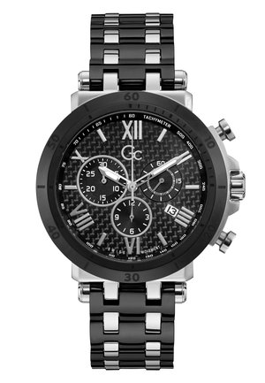 Montre en acier inoxydable noir avec un cadran texturé noir, des accents argentés, des fonctionnalités chronographe et un bracelet à maillons poli.